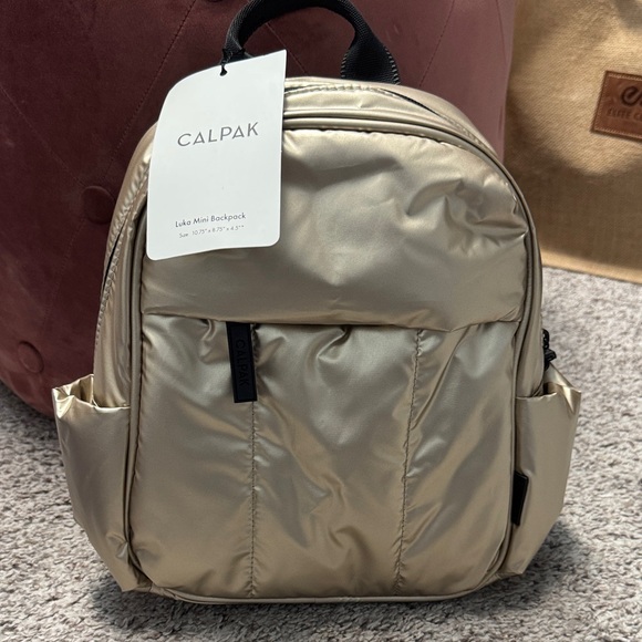 Calpak Handbags - Calpak Metallic Gold Backpack